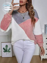 Color block fuzzy knit sweatshirt in soft pink gray and white with a geometric pattern and easy care instructions including tumble dry
