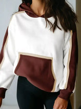 Cozy color block patchwork hooded sweatshirt in white and maroon with beige trim accents made from slightly stretchy fabric and machine wash friendly