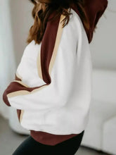 Color block patchwork hooded sweatshirt in white and maroon with beige trim accents made of slightly stretchy fabric and machine wash friendly