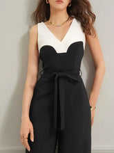 Black and white color block wide leg sleeveless jumpsuit with V-neck and waist tie