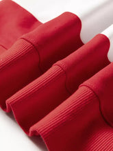 Red ribbed knit cuffs on a red colorblock drop shoulder baggy sweatshirt machine wash cold recommended
