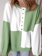 Colorblock henley soft long-sleeved sweatshirt in white and sage green with button-down front and machine wash care instructions