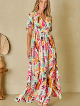 Colorful abstract printed surplice short sleeve maxi dress in vibrant floral hues