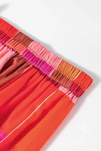 Colorful plaid maxi skirt with orange pink tie-dye shorts