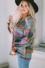 Multicolored plaid patchwork button-up top with long sleeve length
