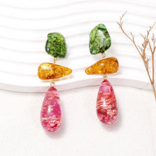 Colorful resinous dangle earrings with green, amber and pink stones