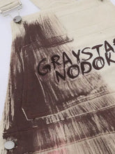 Colorful wide leg overalls in beige canvas, distressed brown paint-splatter, graysta nodok embroidery, machine wash cold