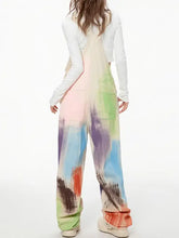 Colorful wide leg overalls in pastel paint-splatter pattern, machine wash cold