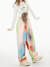 Colorful wide leg overalls in pastel paint-splatter pattern, machine wash cold