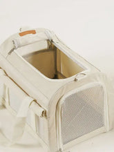 Breathable pet carrier bag in beige with mesh panels and padded handle