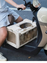 Beige pet carrier with mesh sides and a zippered top, designed for secure transport.