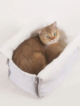 Cozy white plush cat bed in breathable pet carrier bag with fleece interior