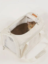 Breathable pet carrier bag with cream color, mesh sides and tan leather patch