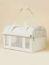 Breathable pet carrier bag in cream with mesh panels and sturdy handles