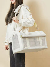 White breathable pet carrier bag with mesh design, padded strap, roll-top