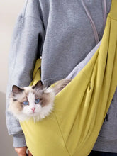 Soft mustard-yellow pet carrier sling with cozy pouch design