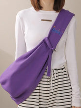 Purple pet carrier sling bag back with embroidered logo and strap