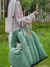 Comfortable portable pet car nest in mint green with black trim and strap