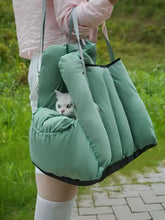 Comfortable portable pet car nest in mint-green puffer with black trim
