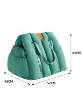 Teal quilted portable pet car nest duffel bag with silver straps, tan patch