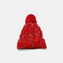 Red cable-knit beanie with pom-pom for 22-inch head circumference