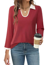 Women’s contrast collared neck long sleeve top in red with white trim, jeans