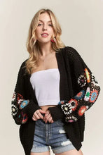 Black contrast crochet open front cardigan with colorful floral long sleeves