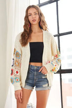 Contrast crochet open long sleeve cardigan with floral embellishments