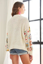 Cream contrast crochet open long sleeve cardigan with floral embellishments
