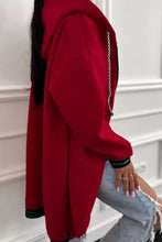 Red hooded sweatshirt with black and green trim and silver chain zipper detail, slightly stretchy and machine wash cold