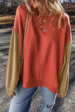 Contrast round neck long sleeve sweatshirt in terracotta with tan sleeves and jeans