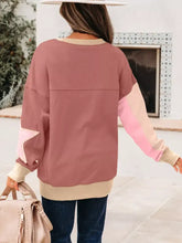 A soft pink and beige slightly stretchy contrast star patchwork sweatshirt with exposed seams and machine wash cold