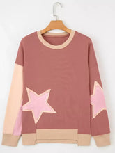A soft mauve contrast star patchwork sweatshirt with beige ribbed details slightly stretchy and machine wash cold