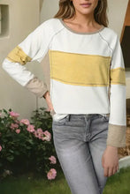 Woman’s color block long sleeve T-shirt with contrast stitching and yellow chest stripe