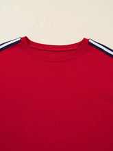 Red varsity sweatshirt crewneck with navy and white striped shoulder accents made for machine wash cold care