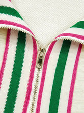 Vibrant contrast striped patchwork zip collar sweatshirt with bold green pink and white vertical stripes and metallic zipper pull