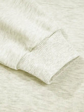 The soft heathered gray ribbed cuff on the contrast striped patchwork zip collar sweatshirt highlights its zip collar design