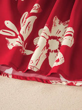Red dress with white floral and butterfly prints featuring a contrast tied neck shirred puff sleeve design