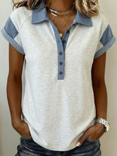 Soft heathered white polo with denim contrast trim and button detail in short sleeves and rolled cuffs design