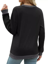 Black casual sweatshirt with contrast trim and ribbed gray cuffs and hem made of slightly stretchy fabric