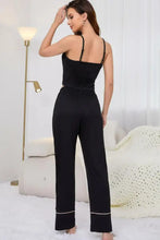 Black satin contrast trim cropped cami and pants loungewear set with thin straps and white piping along pant cuffs product measurements