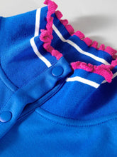 Bright blue knit short sleeve cardigan with white stripes and pink pom trim ruffled collar for stylish wear