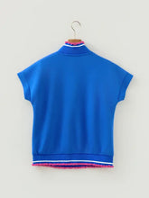Bright blue short sleeve top with pink pom trim and white contrast detailing for casual wear