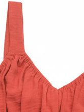 Coral stretch maxi dress with smocked waistband and flared skirt