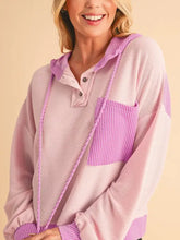 Woman in pink purple corded color block drawstring hoodie