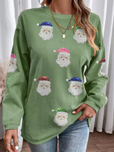 Green corduroy long-sleeved sweatshirt with sequin patched santa claus faces designed to machine wash cold
