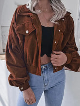 Brown corduroy cropped jacket with hood, buttons, pockets, and product measurements