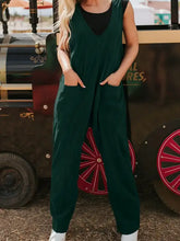 Dark green corduroy v-neck sleeveless jumpsuit with patched pockets, machine wash cold