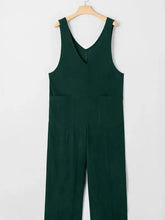 Dark green corduroy v-neck sleeveless jumpsuit with pockets, machine wash cold