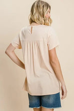 Cotton Bleu Label Eyelet Round Neck Short Sleeve T-Shirt in light peach with keyhole back, paired with denim shorts